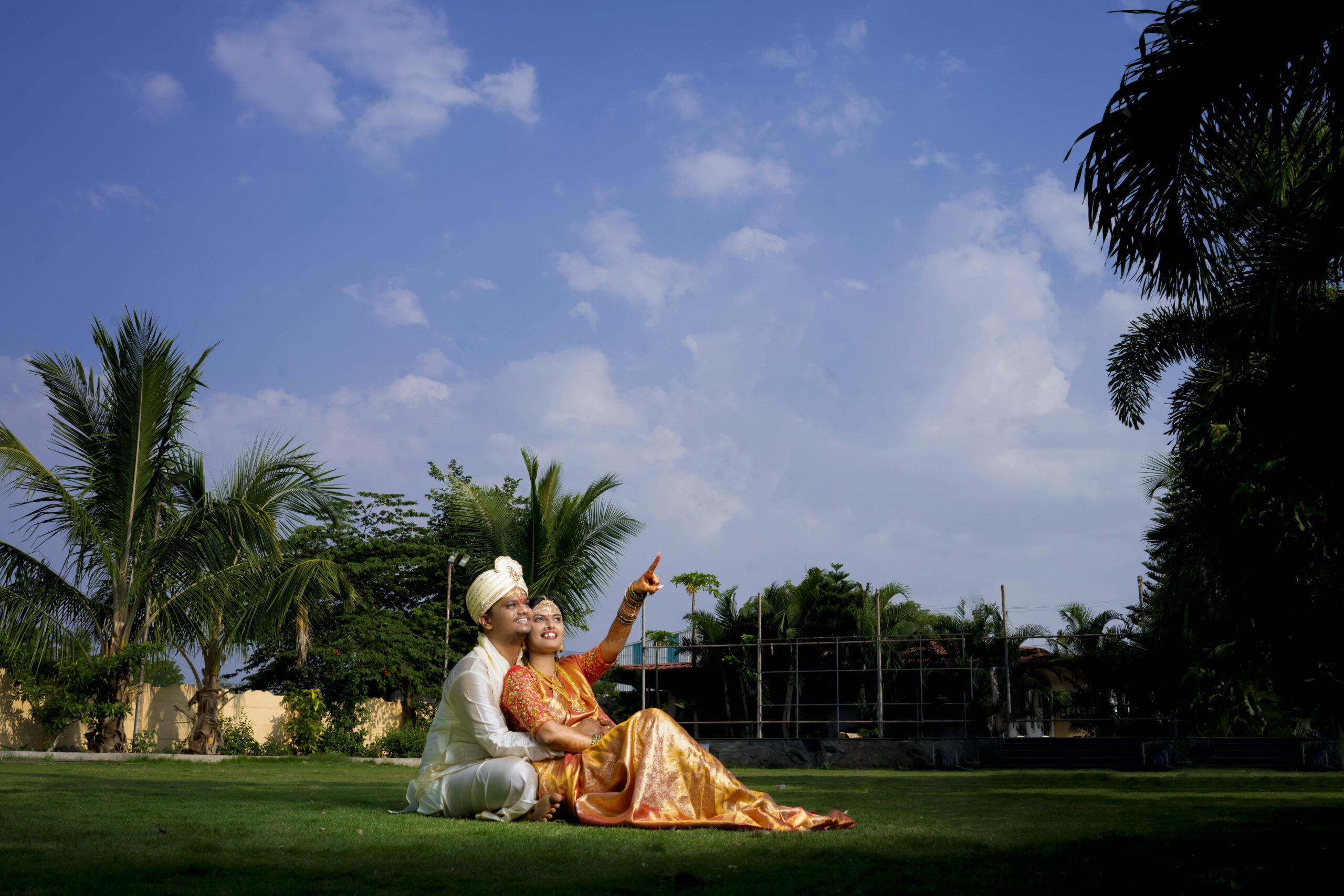 Candid couple moment during an Indian wedding in Hyderabad, captured outdoors.